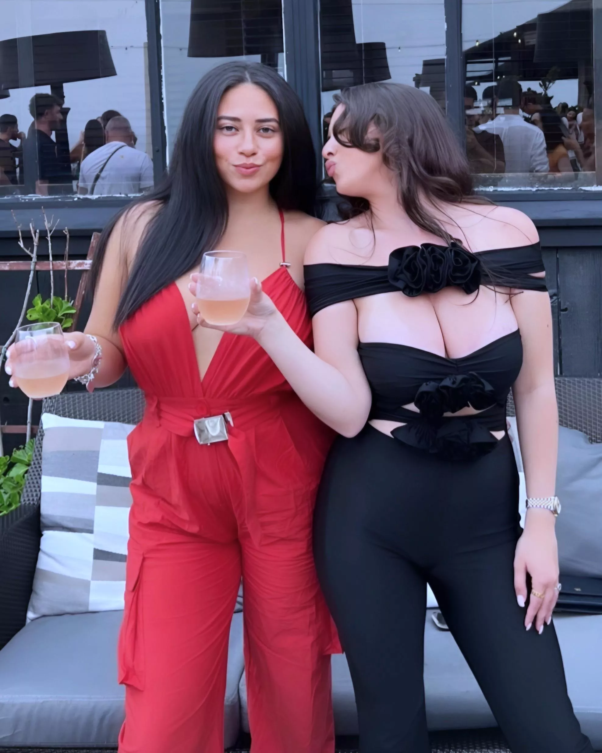 Spilling out her shirt on the right