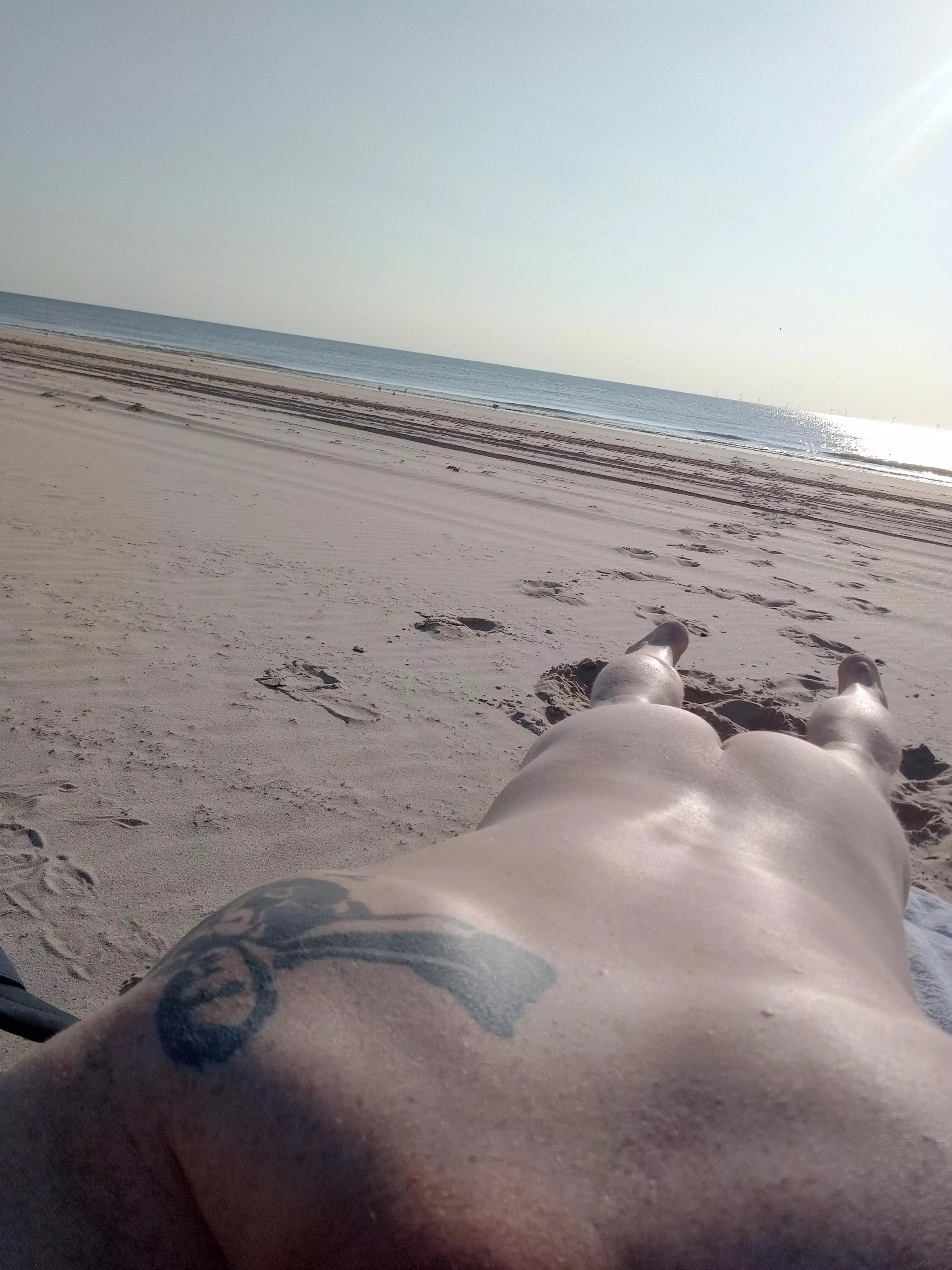 Evening sun on nudebeach; water calm & refreshing