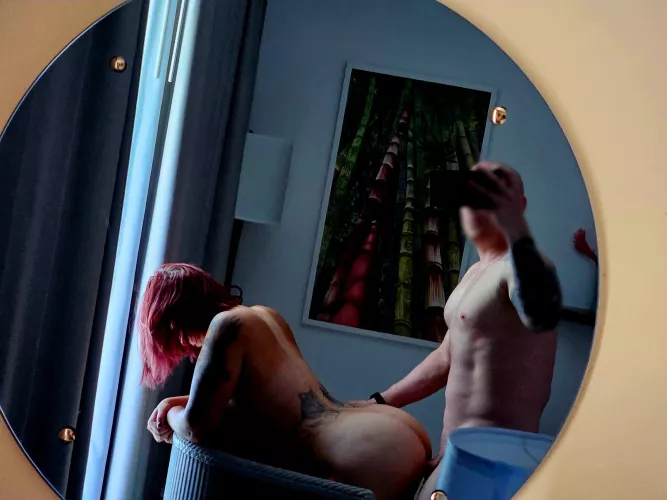 Having fun in the hotel room against the window