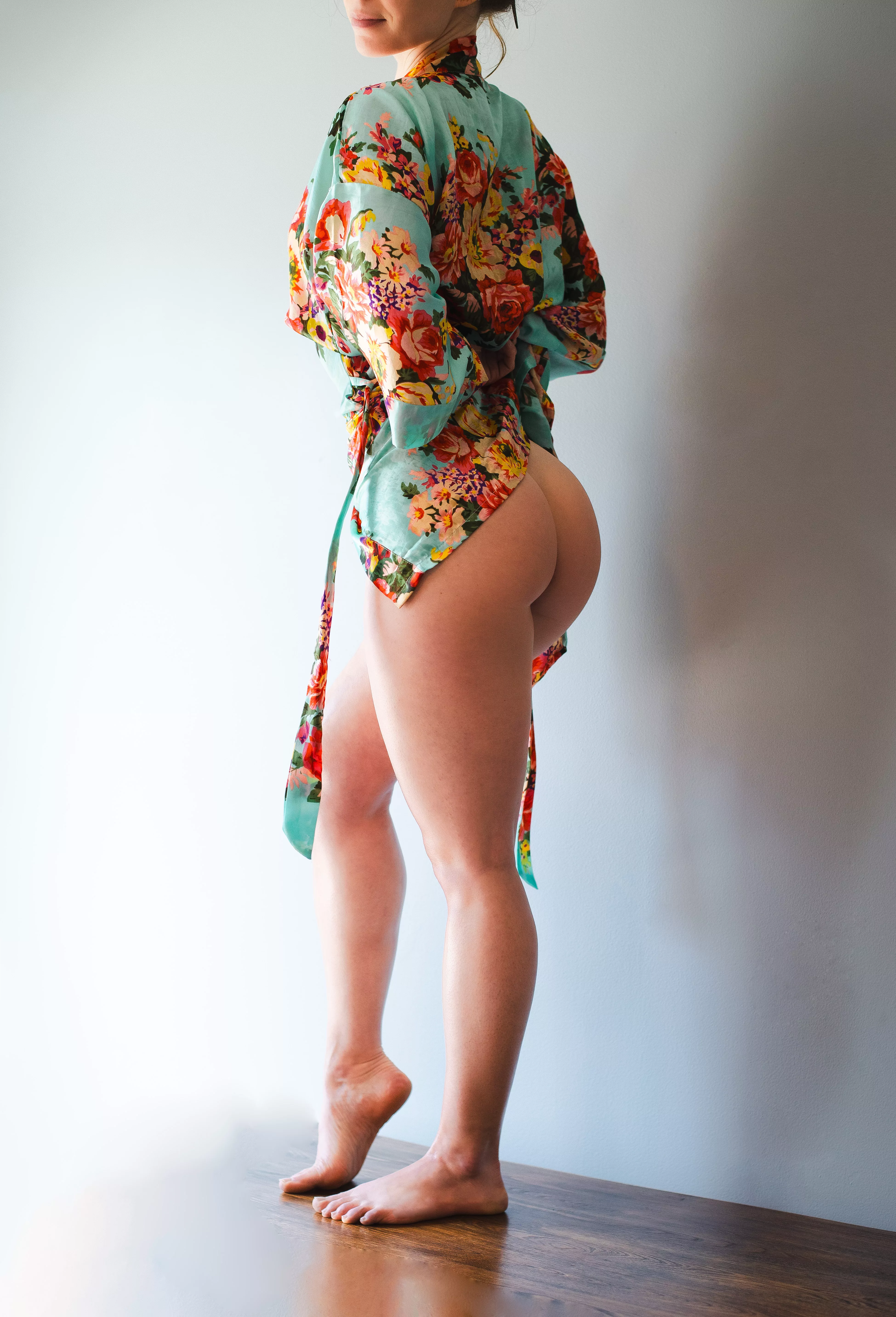 Robed in petal hues.. She walks in dawn's tender light.. Beauty softly blooms.