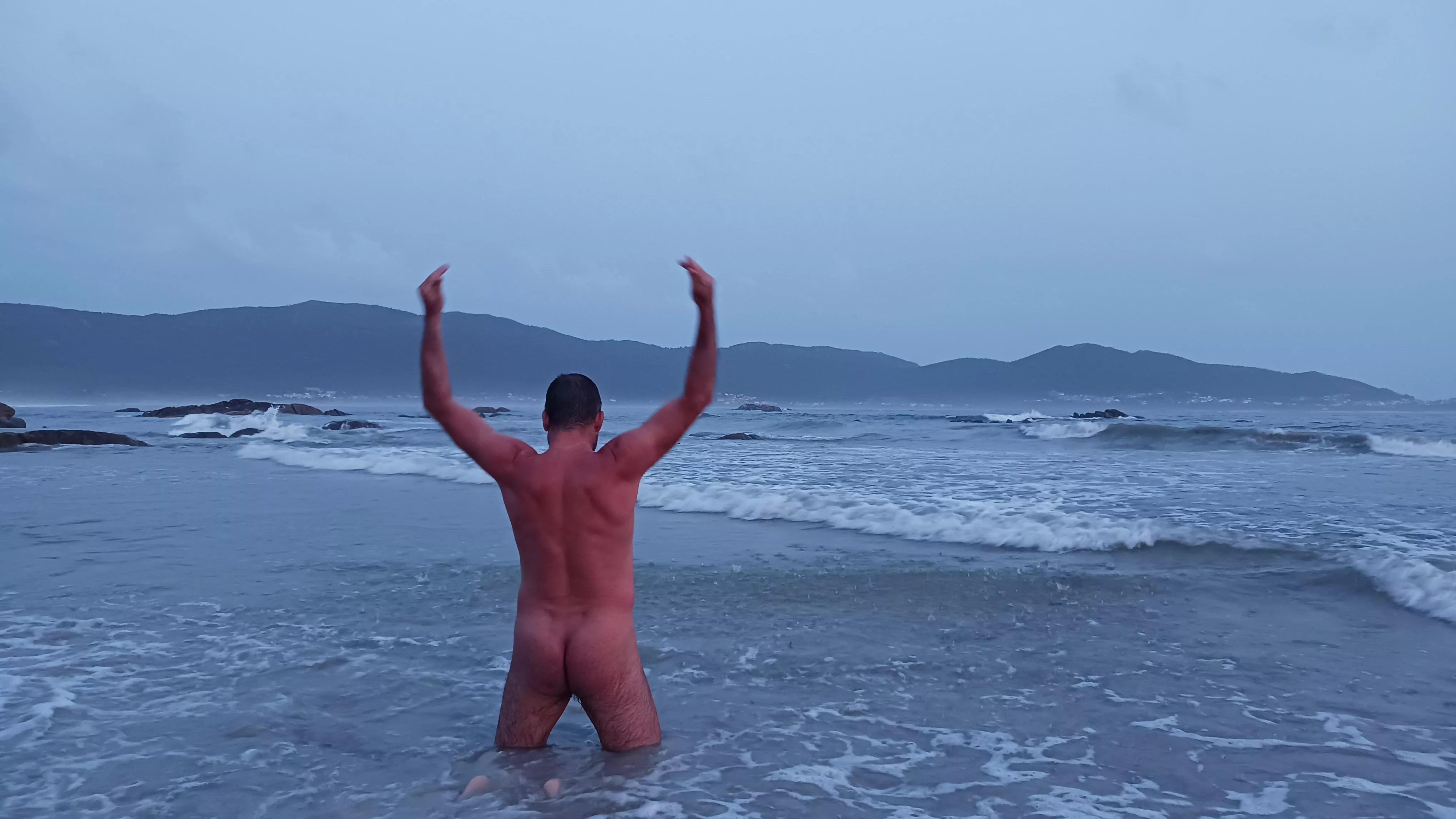 Cloudy beach day nude body bathing