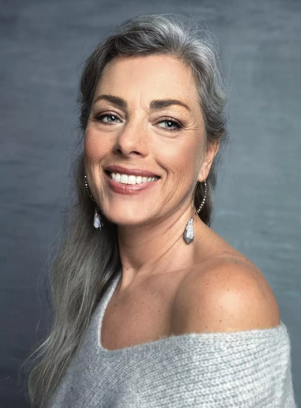 Smiling off the shoulder mature