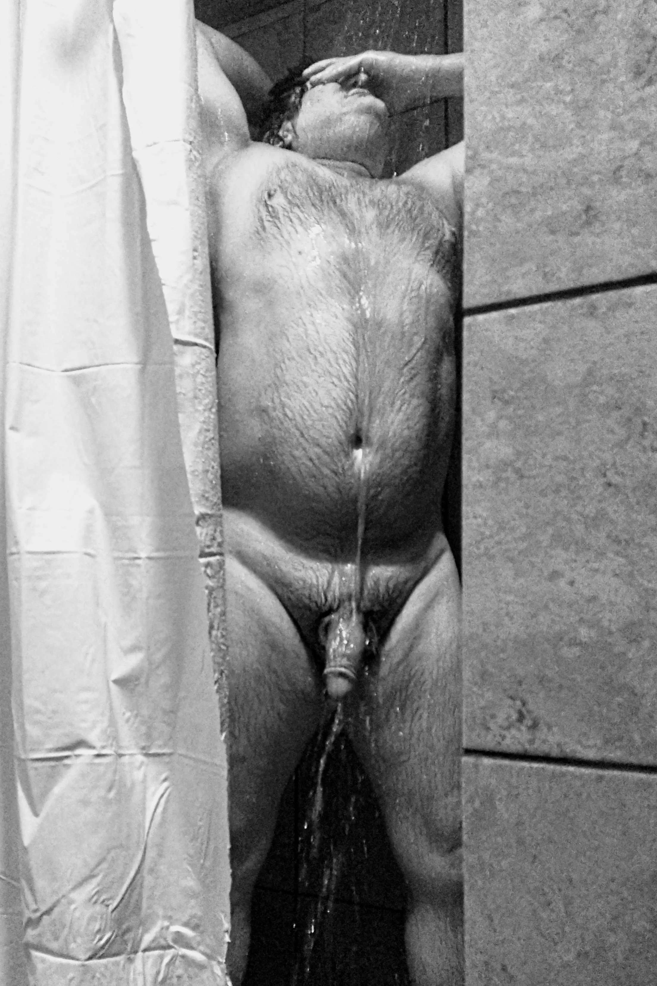 Daddy on display in a locker room shower.