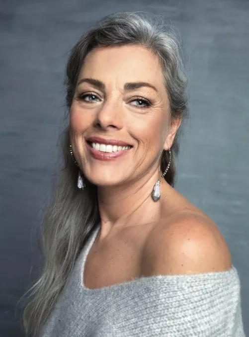 Smiling off the shoulder mature