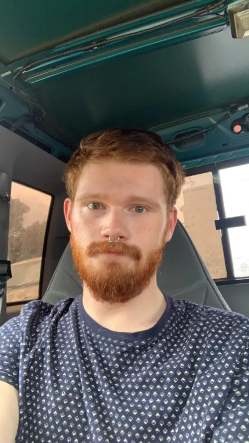 The face of someone who has a love hate relationship with driving.