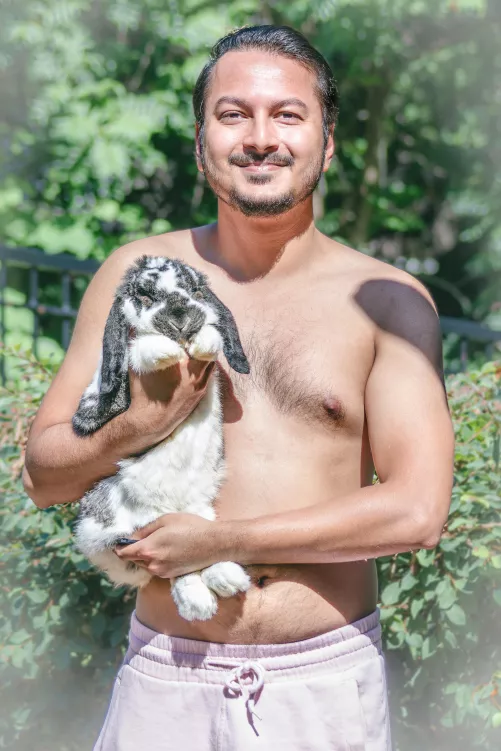 A guy in his 30s and his bunny saying hi!