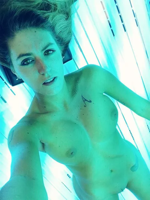 Beachy Blonde, natural tits, nice tats.