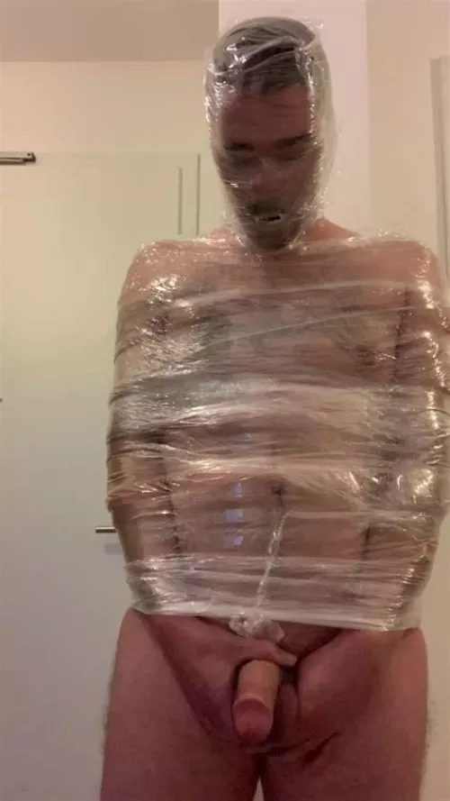 self mummification in tape and plastic wrap