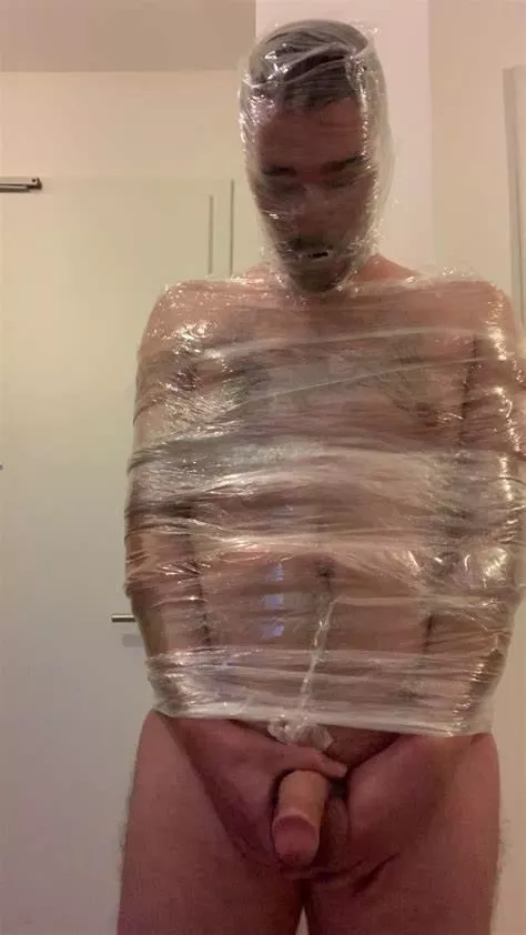 self mummification in tape and plastic wrap