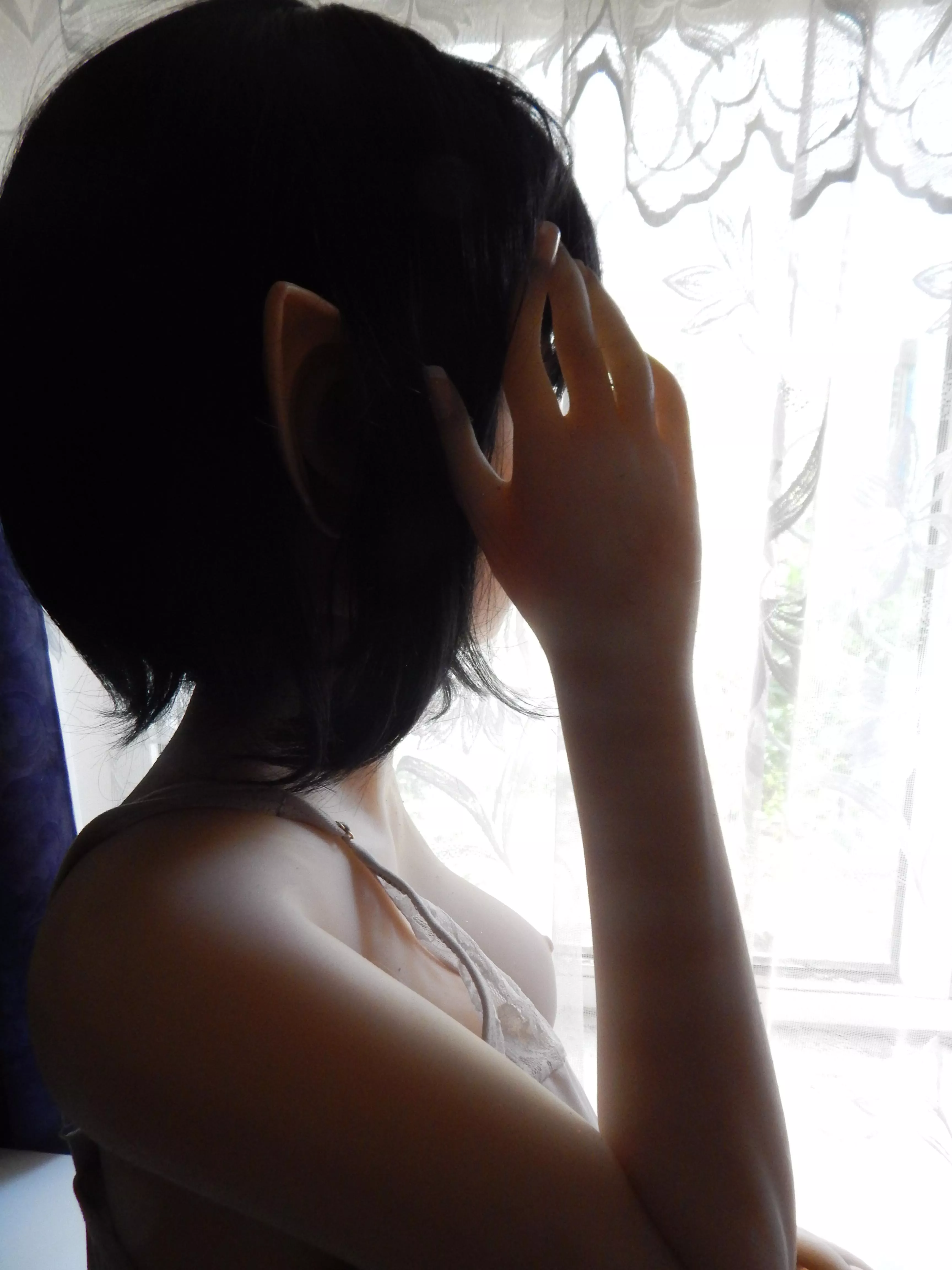 Brunette elf is hiding face...