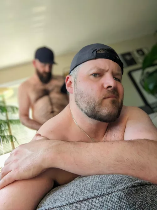 Hunched over the ottoman