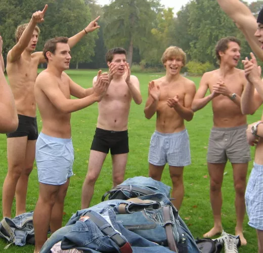 Team mates strip down to their boxer shorts on the field.
