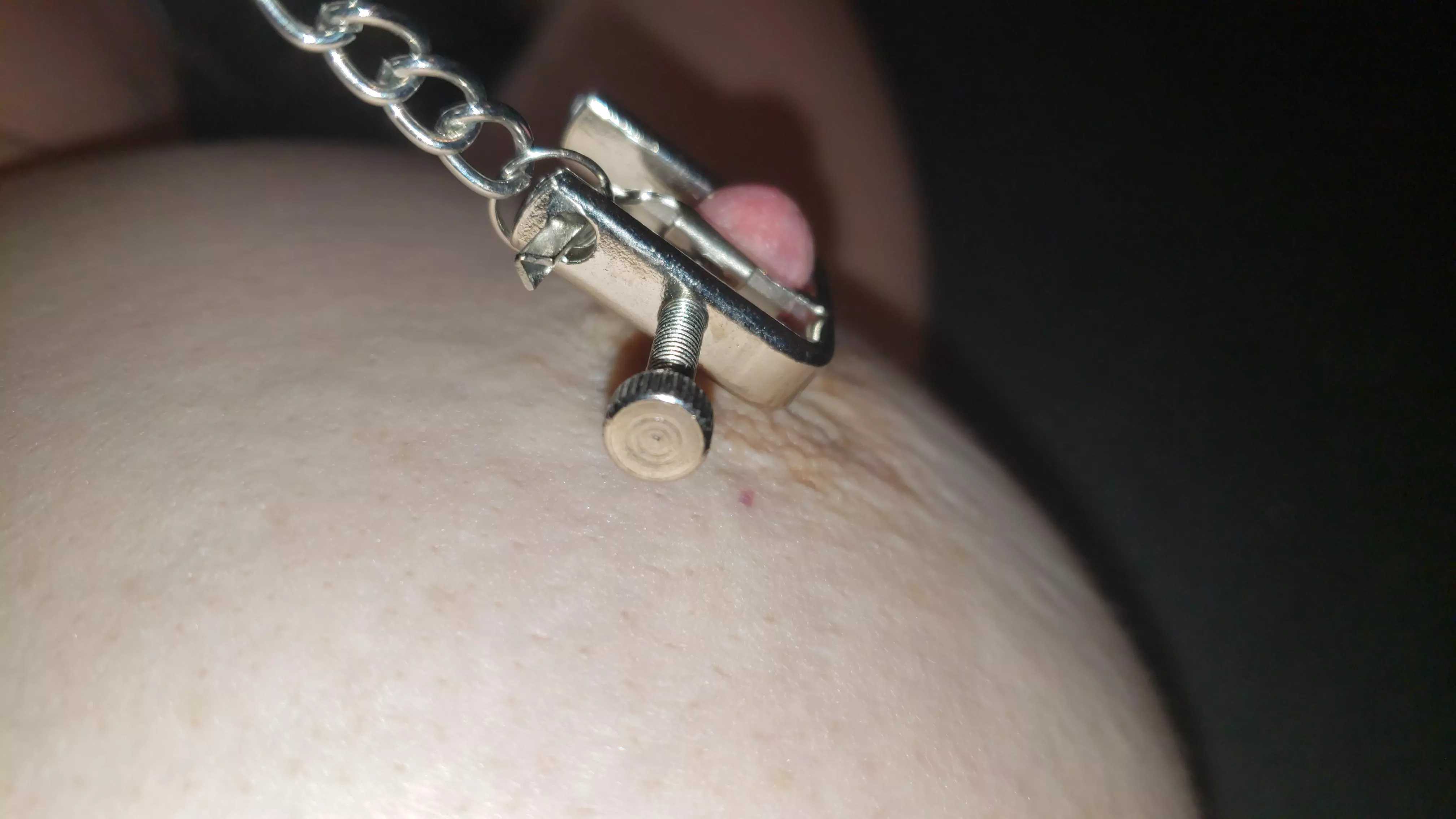 Clamped nipple tug