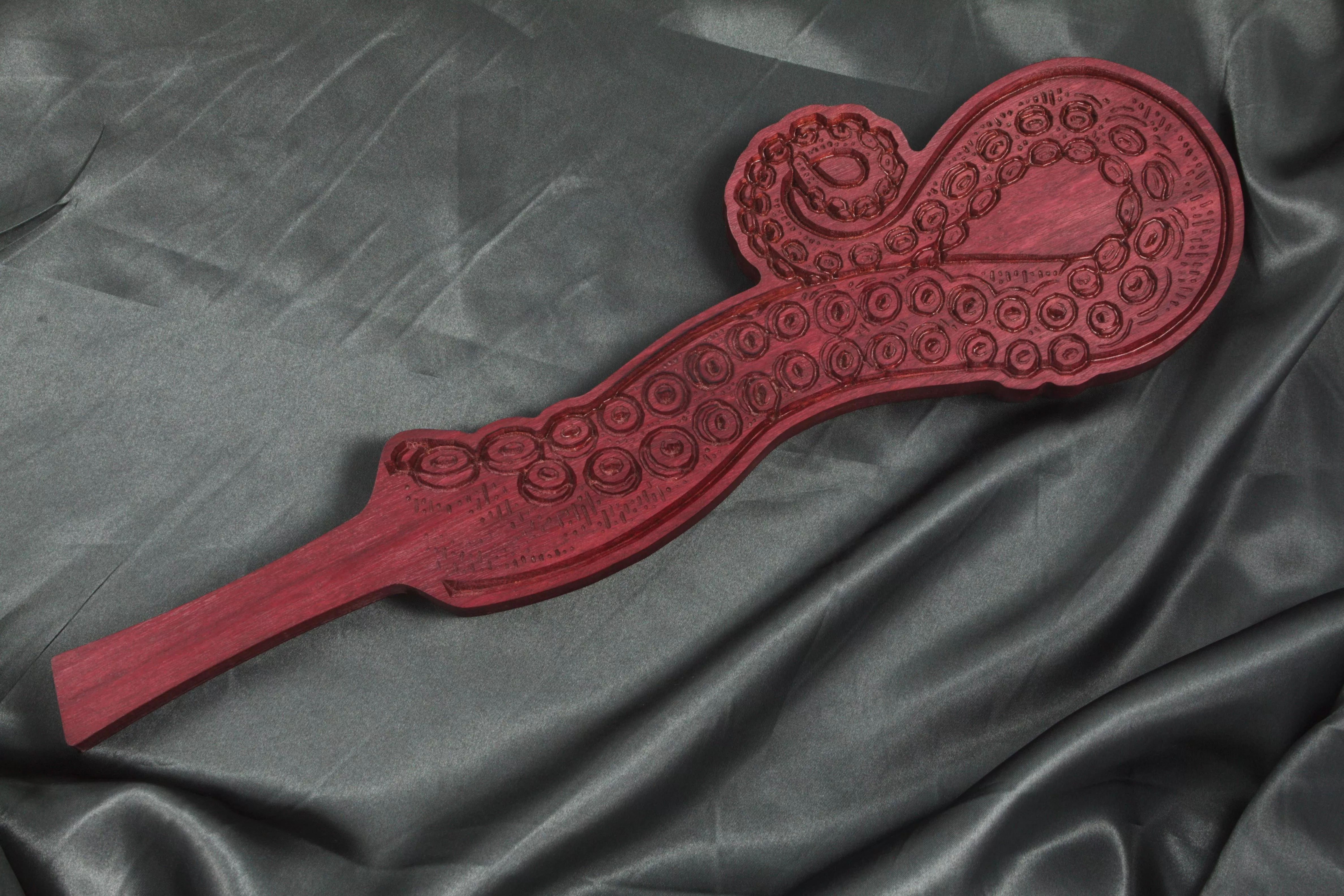 I made a purple heart tentacle imprint spanking paddle.