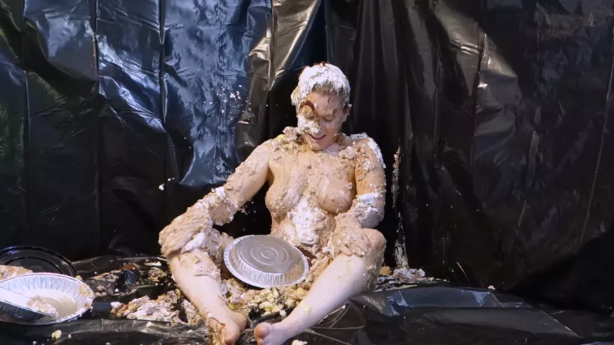 Stella looking at all the ruined dessert in her lap