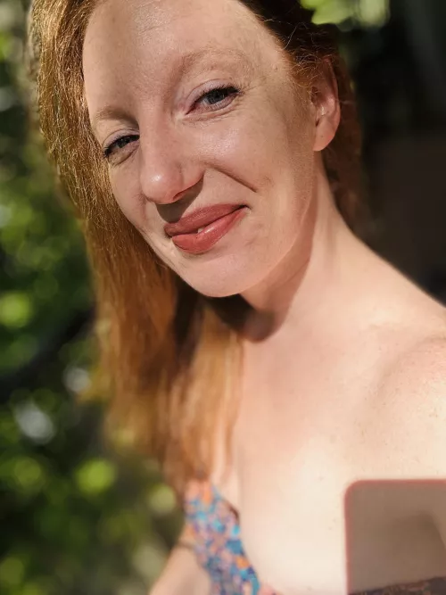 Enjoying the sun and a nip slip