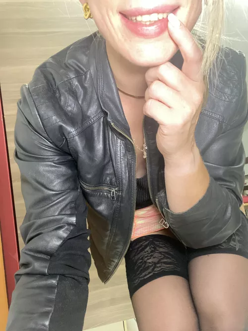 Ladies in leather jacket with big smile