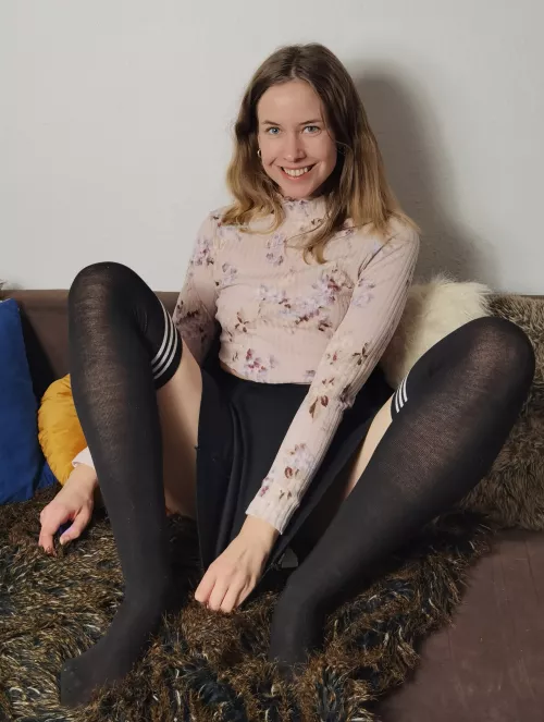 Black skirt, black kneesocks and a smile