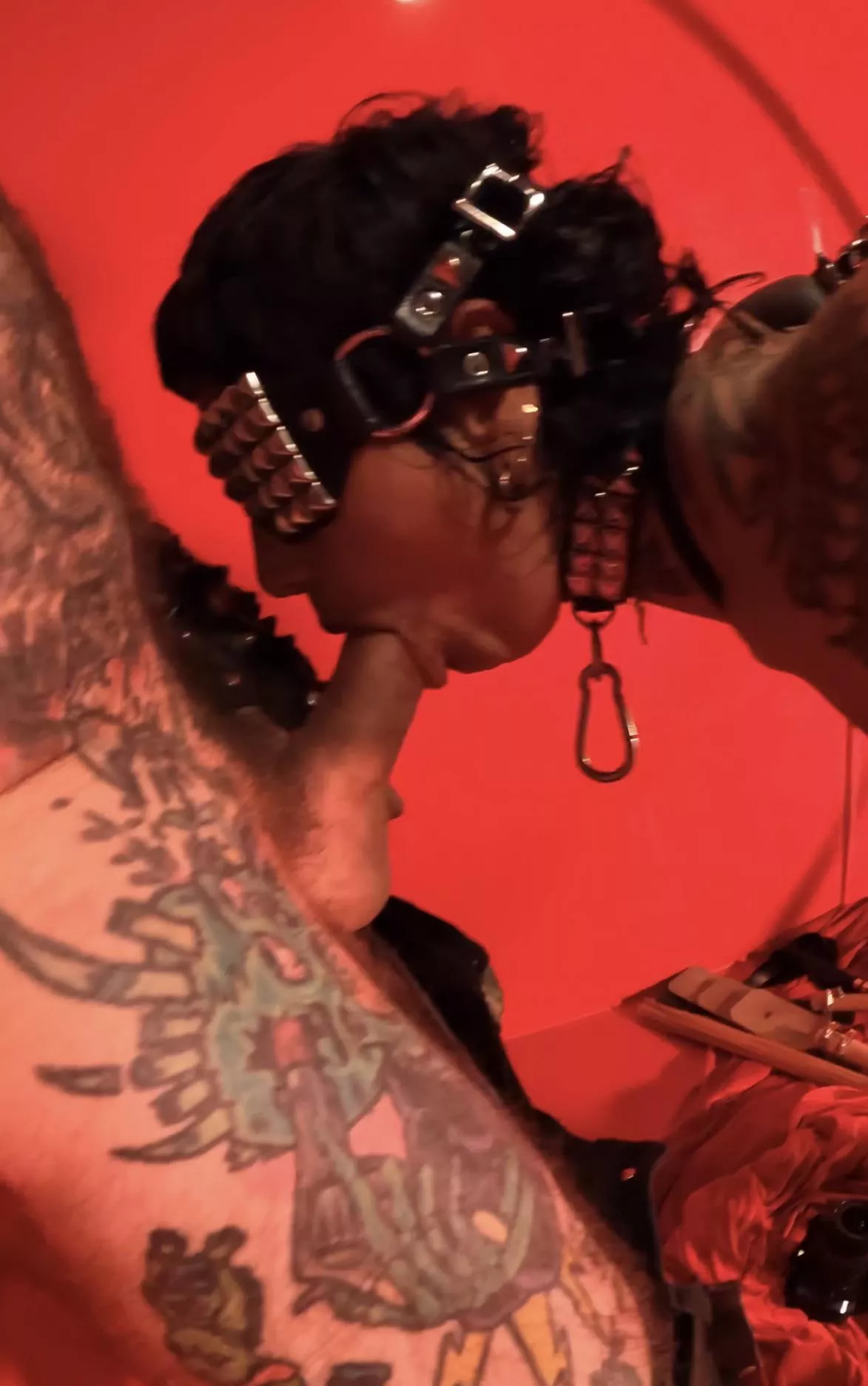 Tied up with chains and forced to give a blowjob