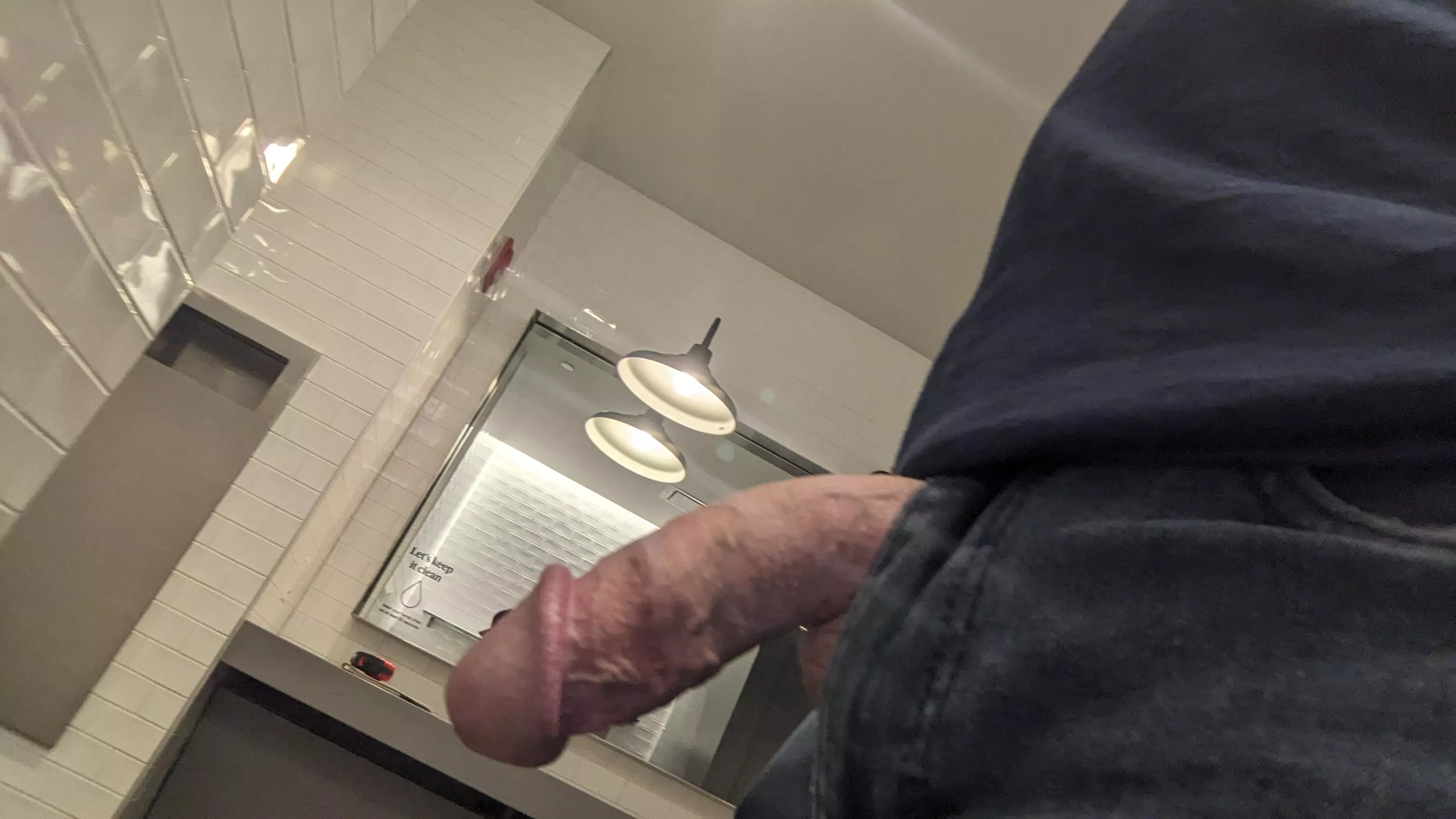 Waiting by the urinals