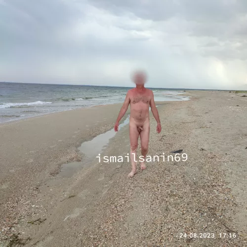 Naked by the sea after a thunderstorm