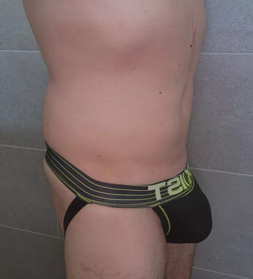 Rocking the jock in the gym locker room.
