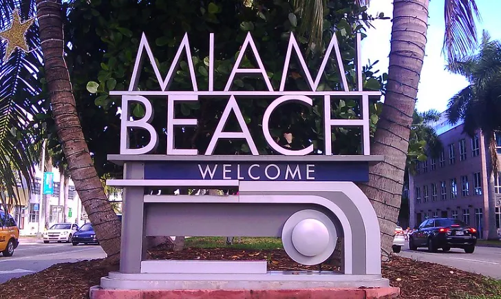 Located in South Beach Miami Florida on 5th St. and Lenox Avenue intersection. You see the Miami Beach Welcome sign after traveling on the The General Douglas MacArthur Causeway Florida A1A crossing over Biscayne Bay on the way to the Atlantic Ocean.