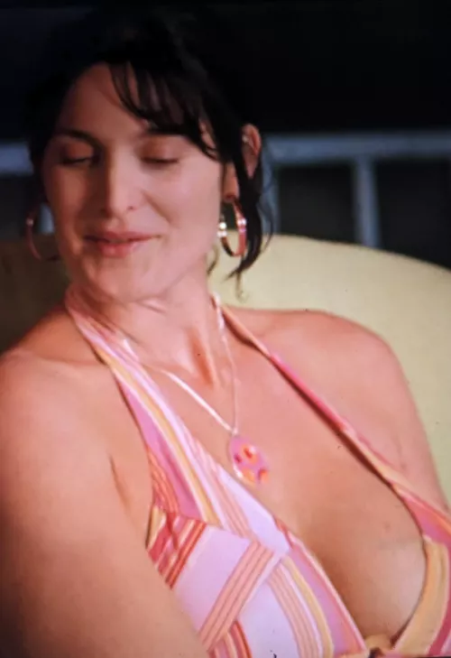 Carrie Anne Moss's big cleavage after having a kid