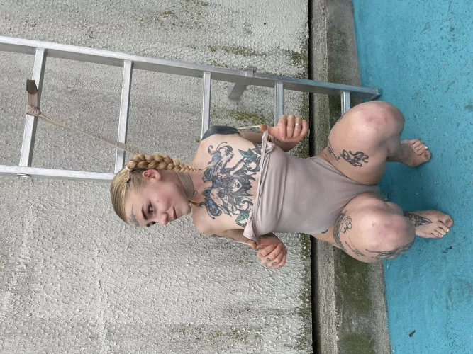 Tattooed beauty with a spellbinding touch