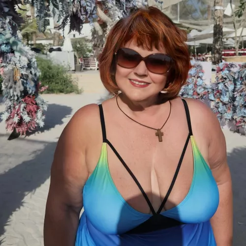 Love wearing my sexy blue swimsuit. It looks good on my boobs.