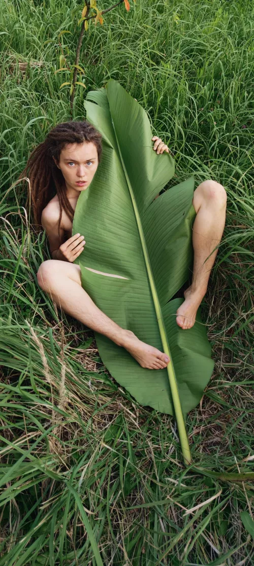 hiding under a banana leaf