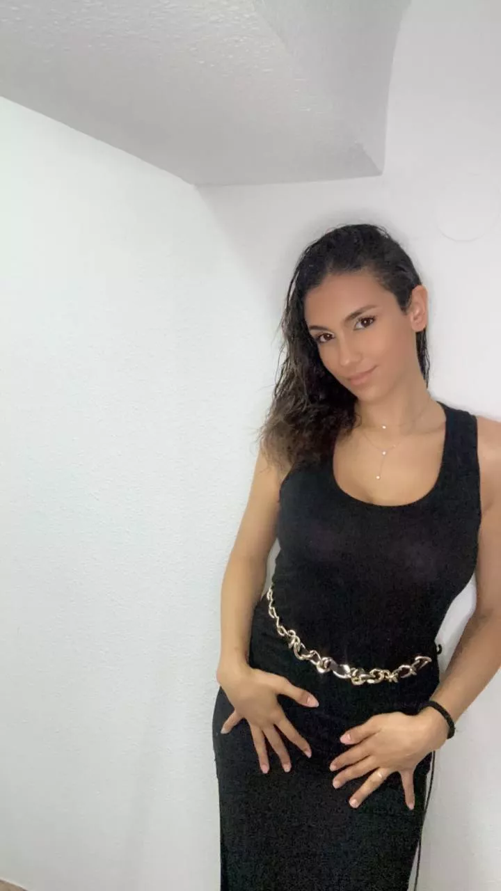 Brunette beauty in black ready to get taken on a date