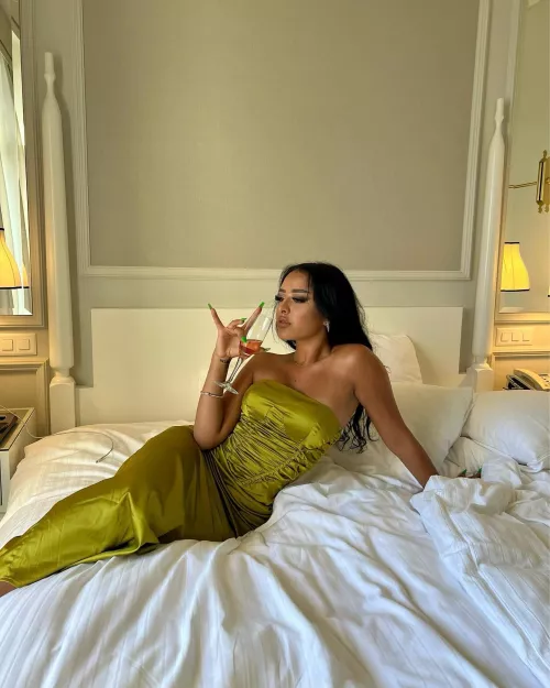 A lady with a class wearing a tight dress