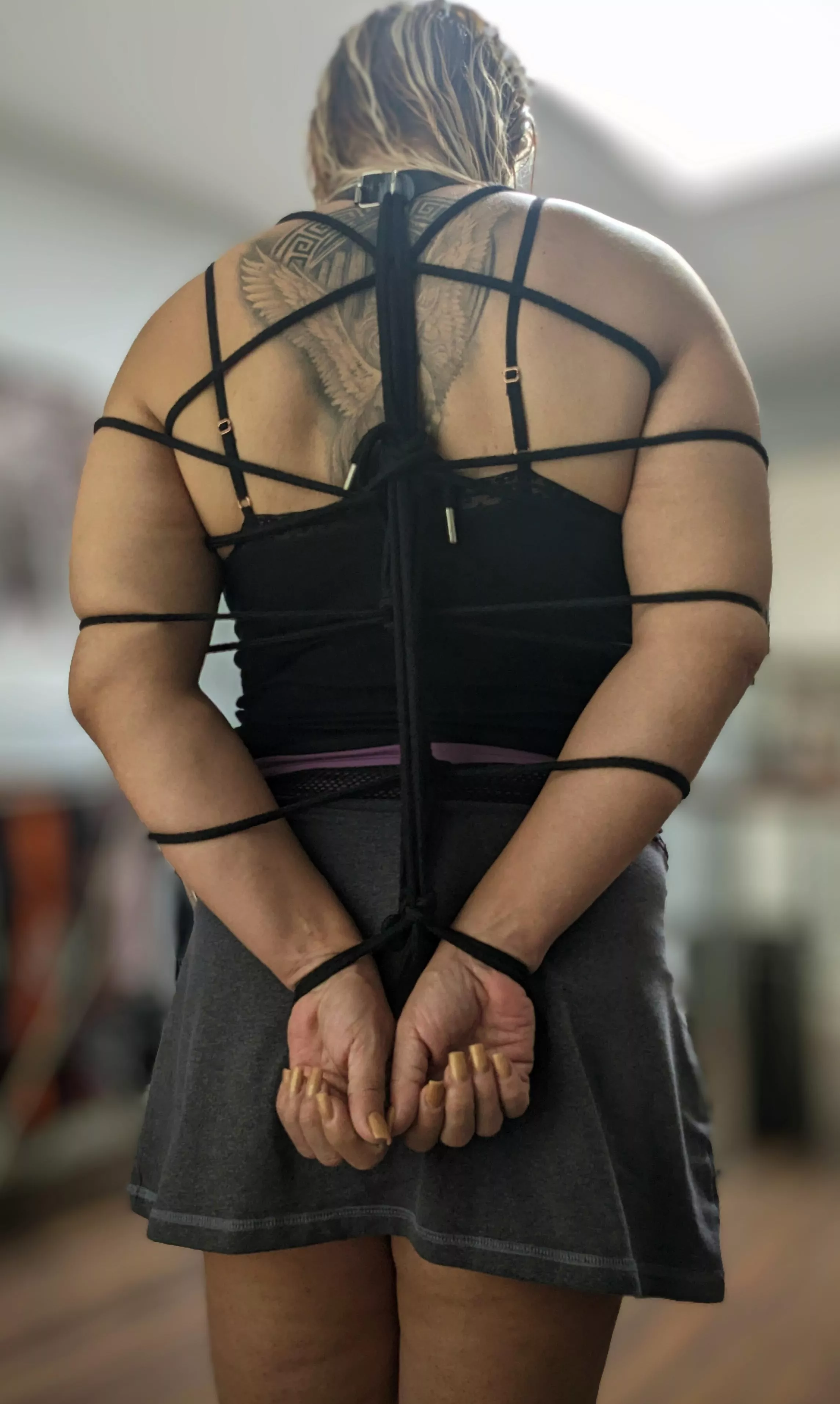 First try to tied her hands on back