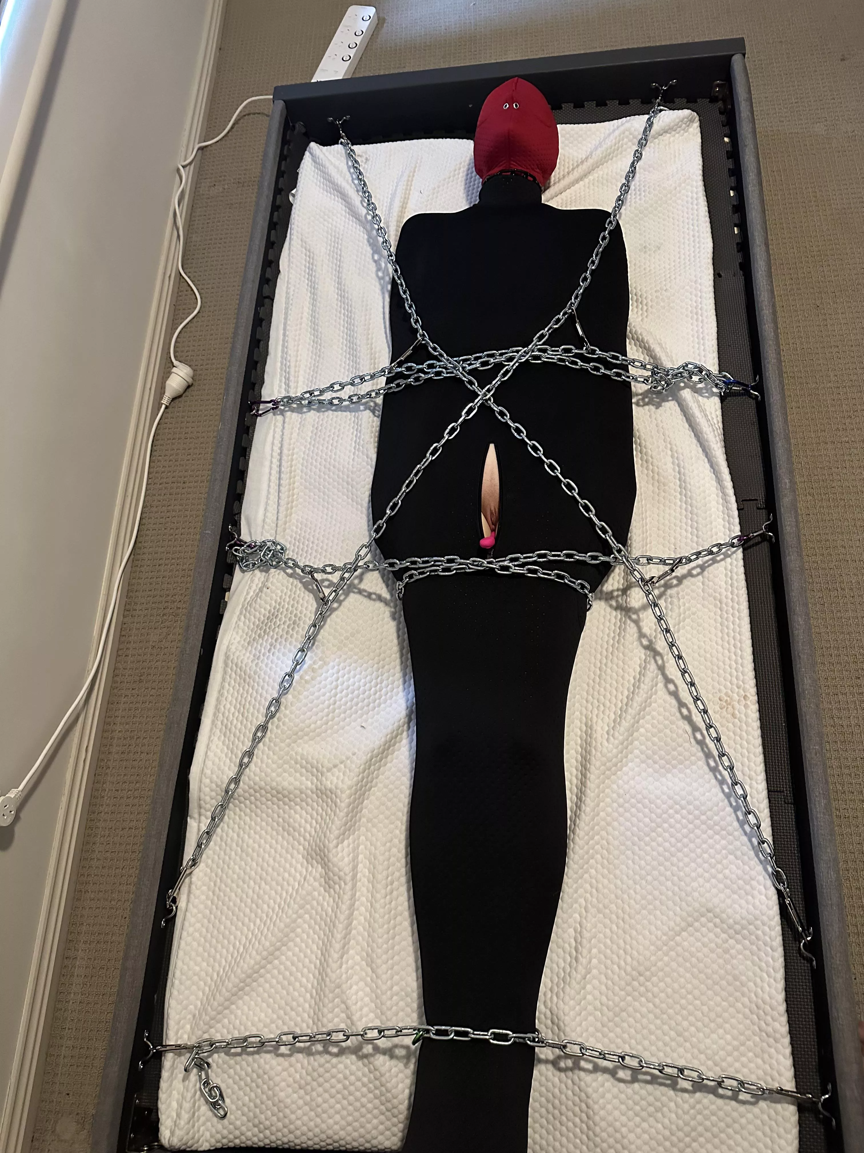 Why would I let you go? 😈 (panty gagged and eye patches under the hood, chain tightened around the neck and attached to the bed for choking effect, earphones playing white noise, vibrating butt plug and phone controlled egg in her pussy.