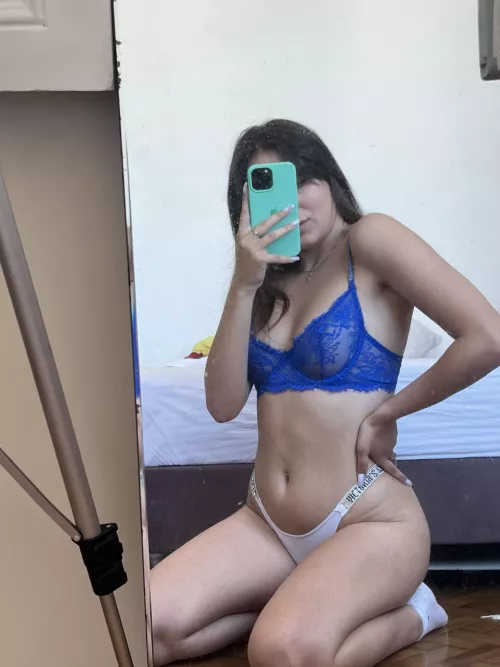 Caught in the mirror's seductive gaze.