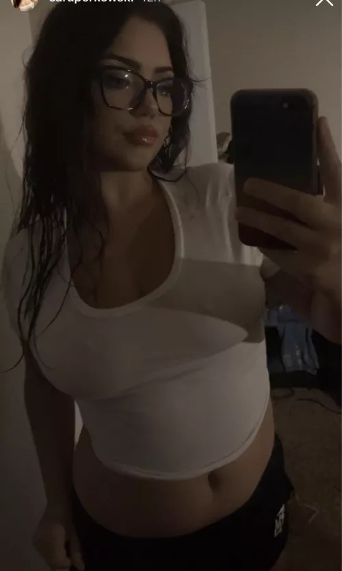Poking thru her shirt