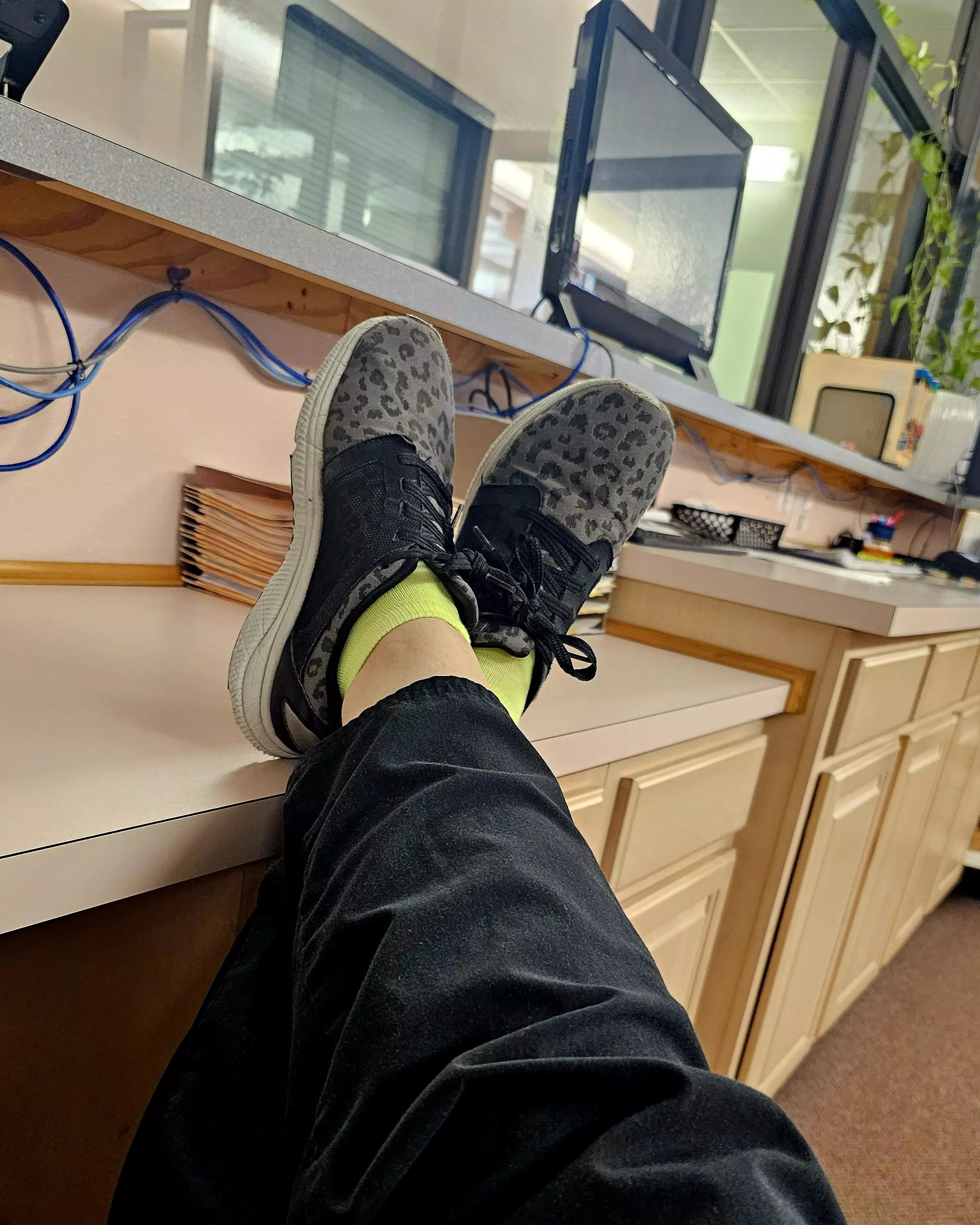 My lime green ankle socks are peeking out over my year-old sneakers at work today 🤭