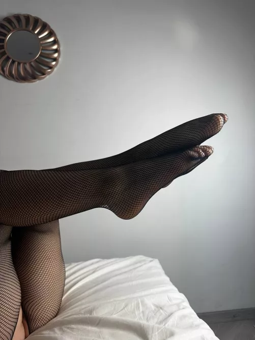 You'd like to feel my legs in these beautiful fishnet stockings, wouldn't you
