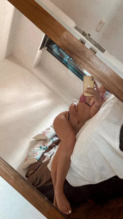 Sideways on the bed showing the feet that you like so much