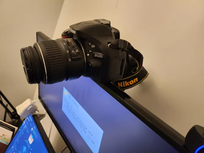 Learned tonight from cdome that I could use a DSLR as my web cam & just had one being unused for 5+ years. I went to mount w/ duct tape but he suggested against it. Ended up wrapping neck strap around the monitor mount, leaning it off the front. It'