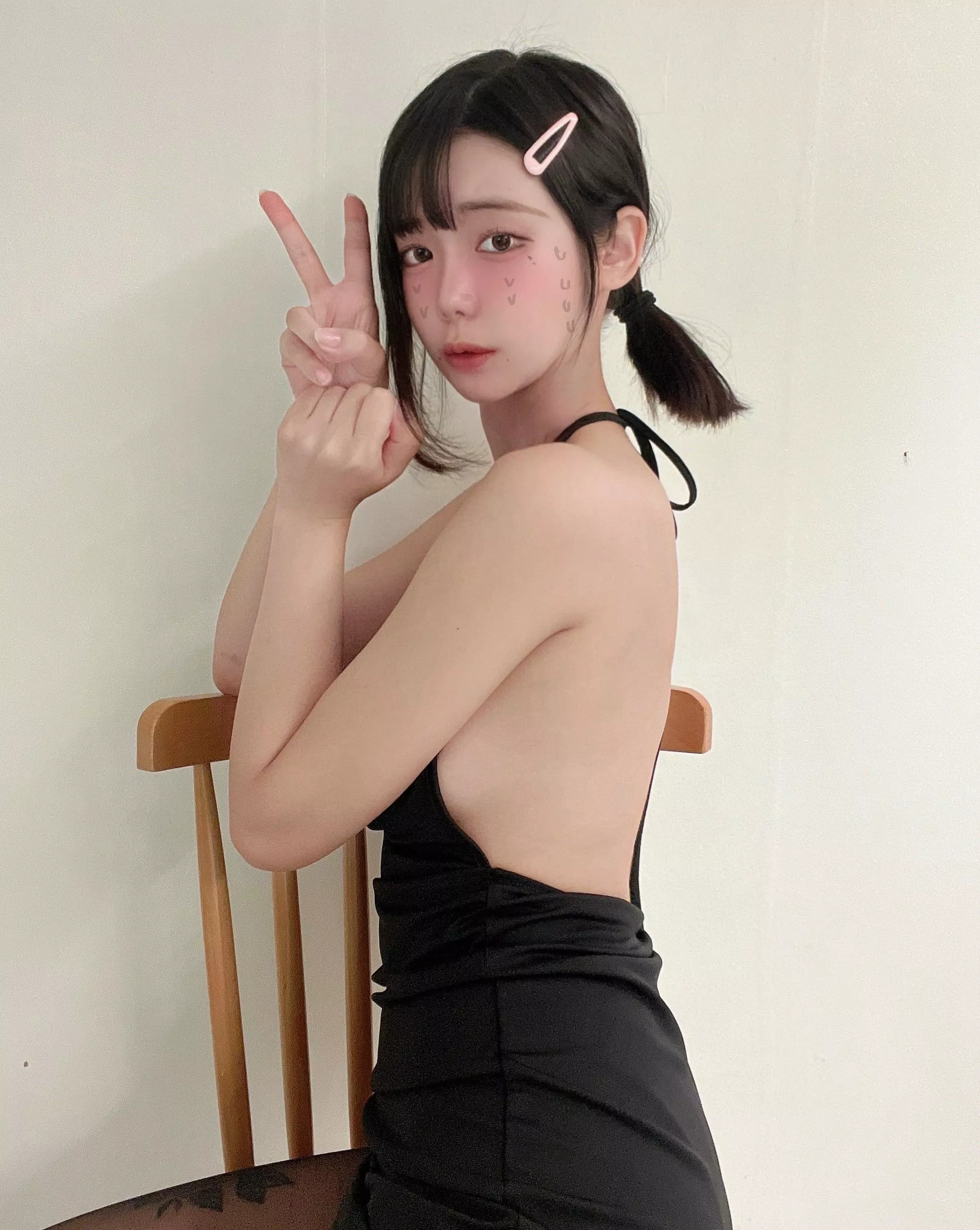 The way this black dress complements my skin tone is appealing, do you agree?