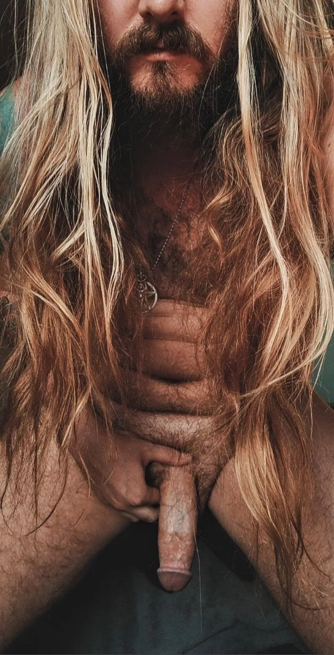 Long blond hair + beard + tattoos