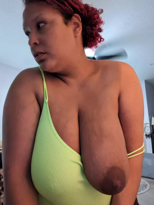 Letting one titty out.