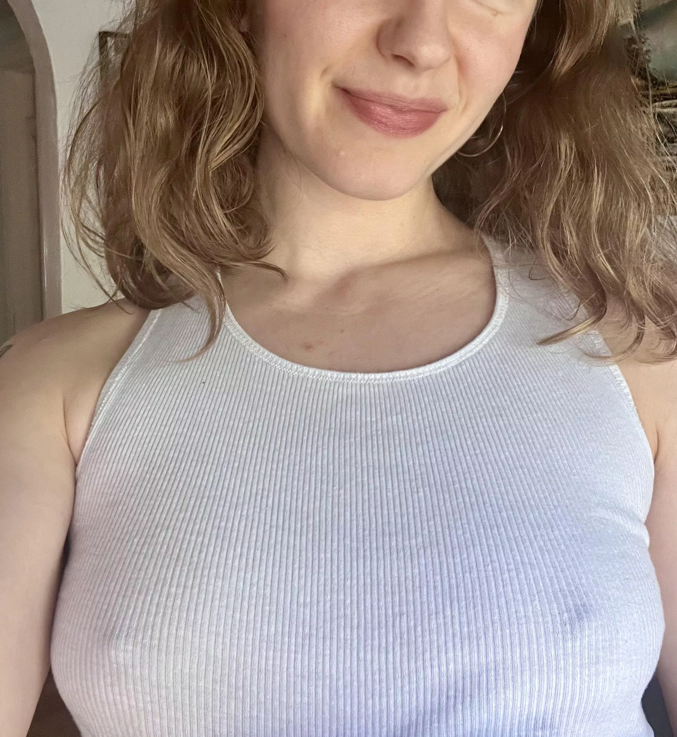 This white tank looks better without a bra