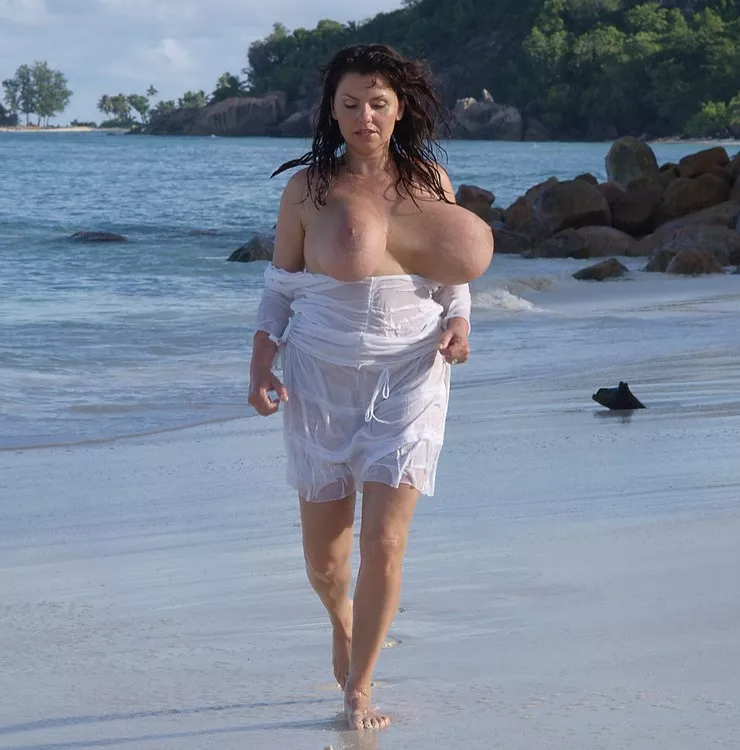 Milena proves it's possible to run at the beach with larger than average breasts .....