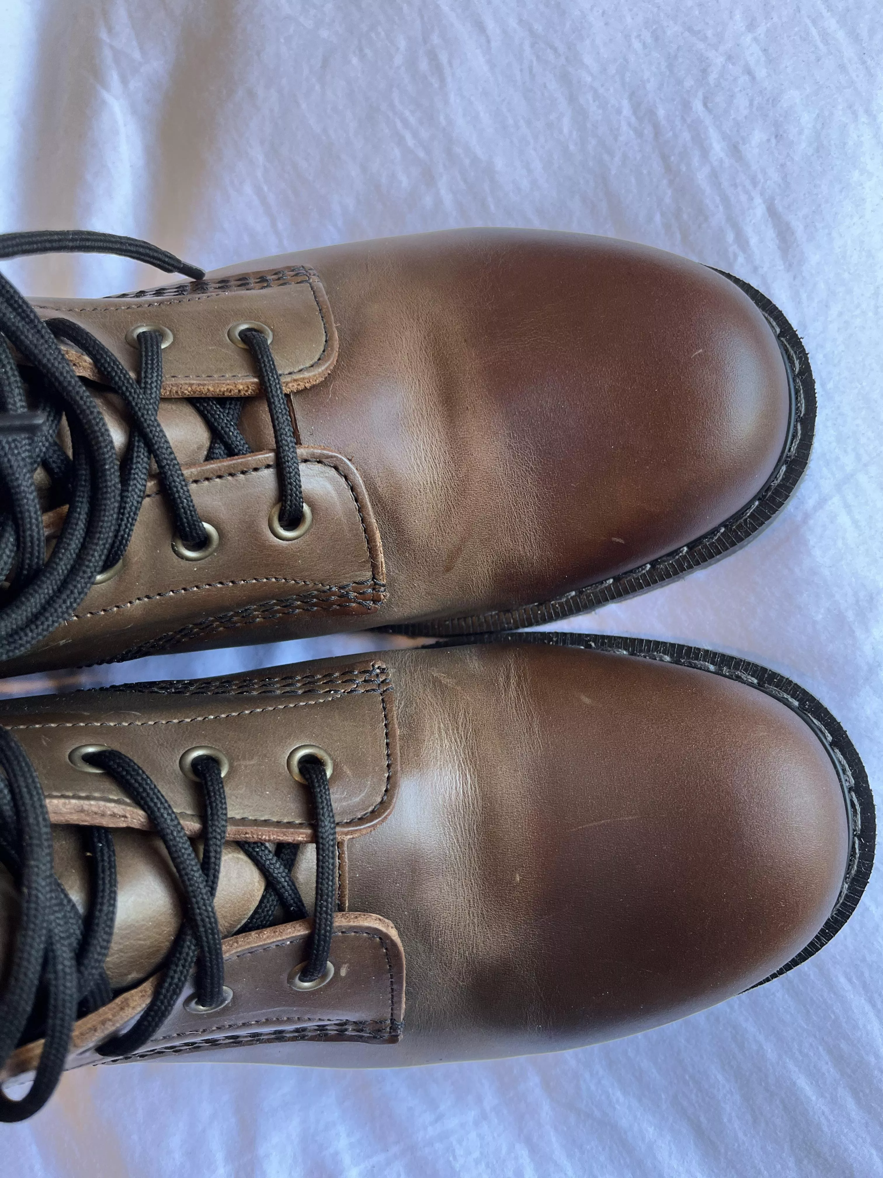 Does anyone know what causes this lighter area where toe cap bends ?