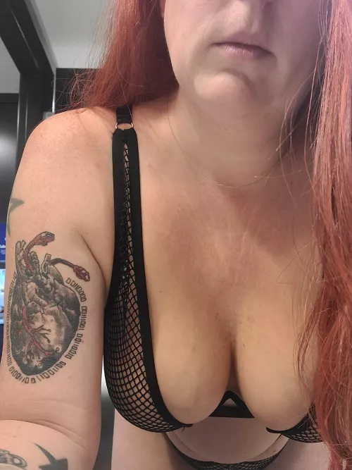 hanging cleavage in fishnets