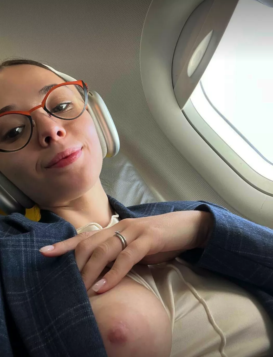 Just being cute in the plane with my tits out