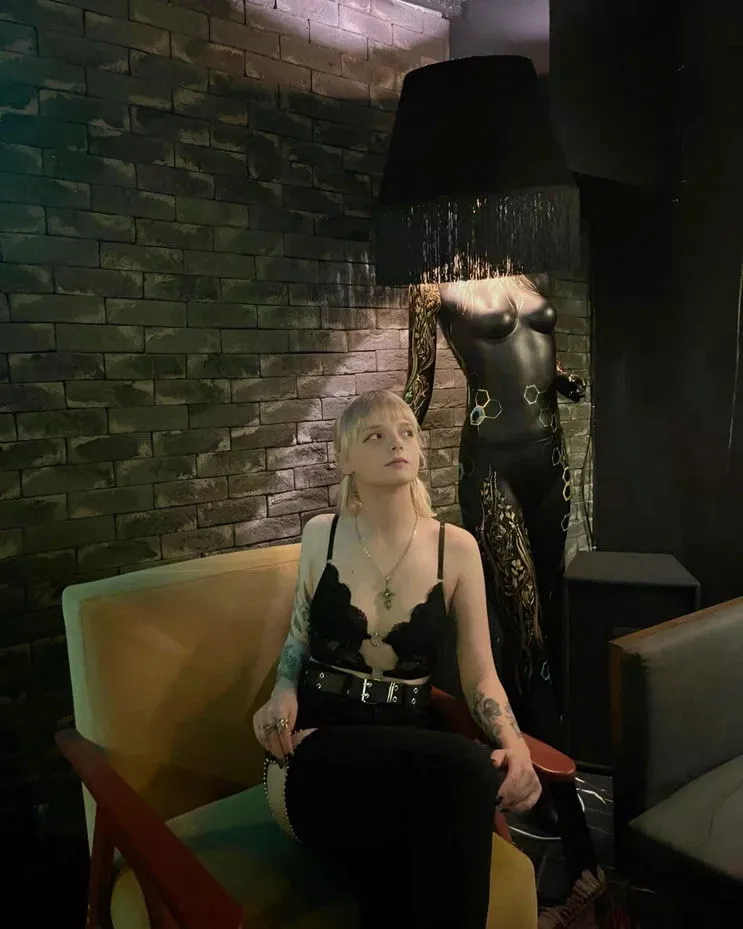 Why does she have a chandelier on her head?